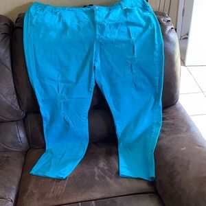 Distressed turquoise jeans